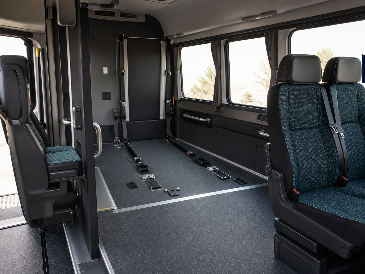 Spacious accessible minibus interior with wheelchair securement bay and companion seats